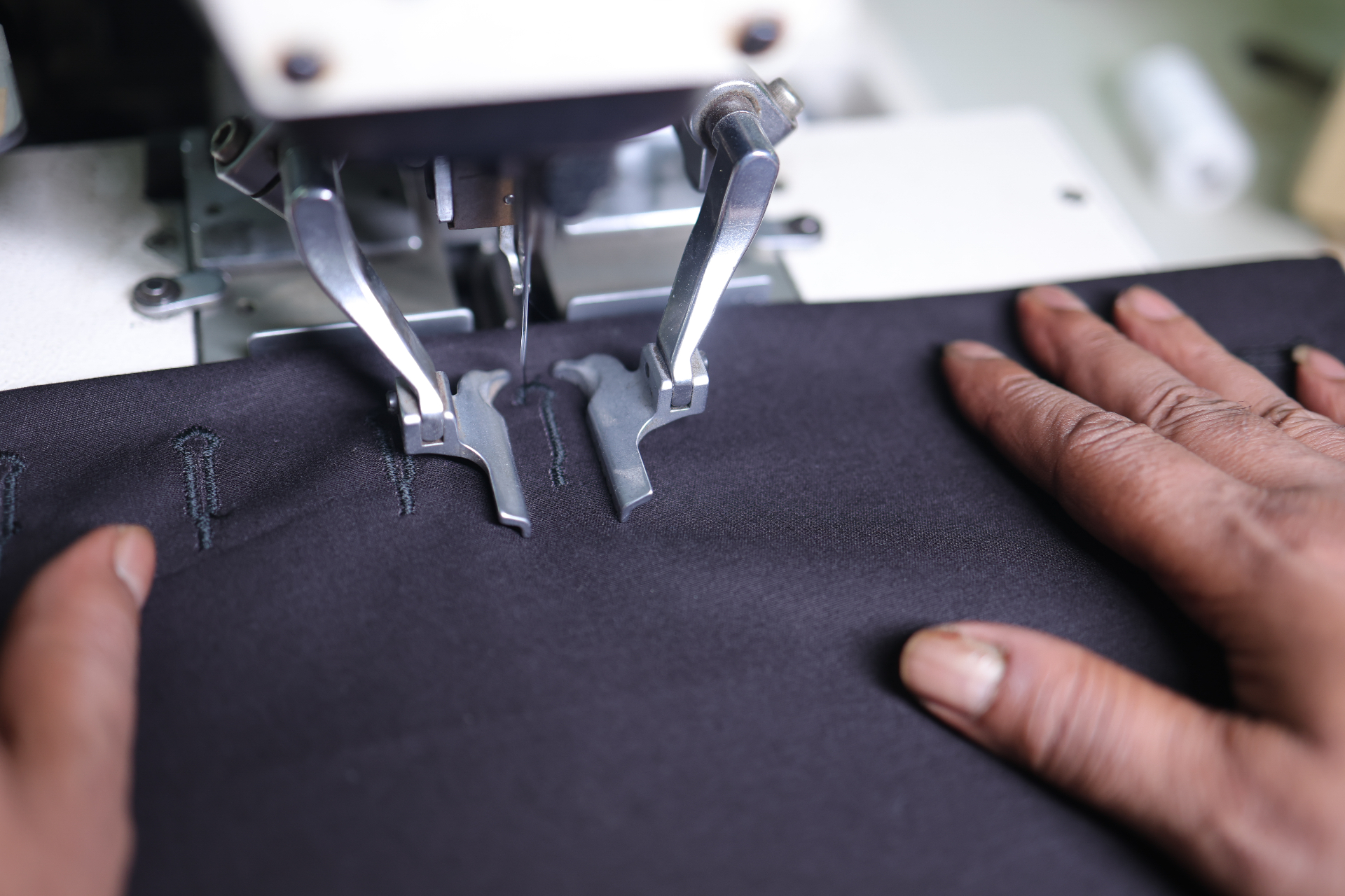Buttonhole machine stitching on dark fabric