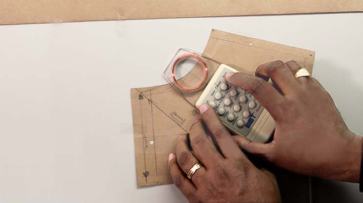 Pattern maker developing a CAD pattern by hand